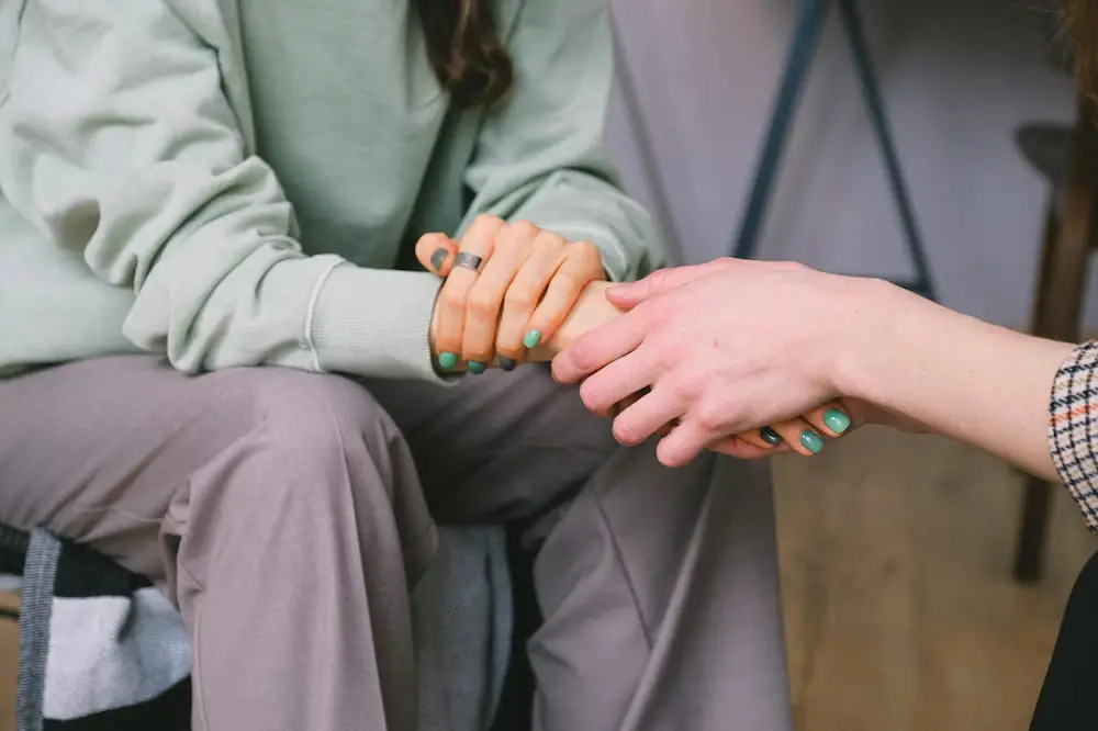holding hands as support during alcohol relapse
